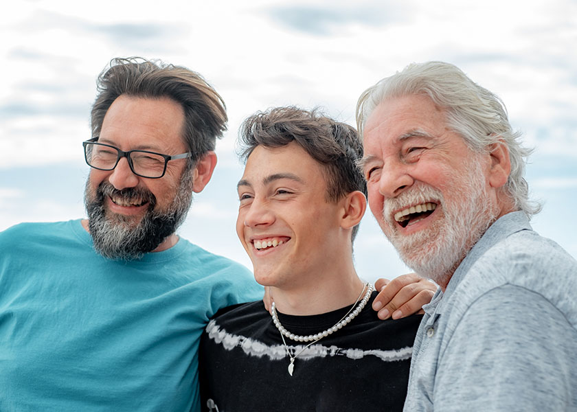 Multi-generational men laughing